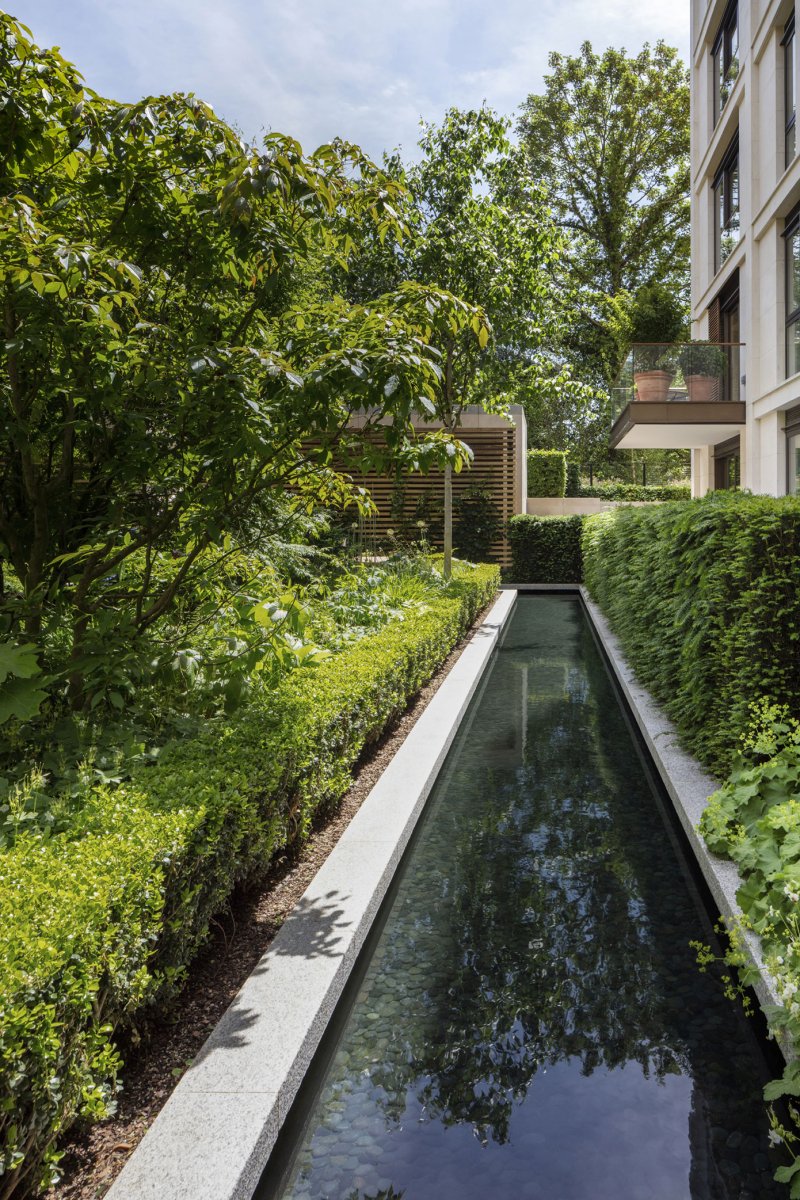 Reflection pools sit within soft planting